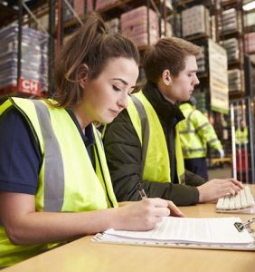 graduates working in a warehouse