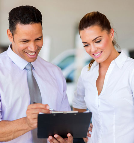 man and woman discussing a meeting schedule